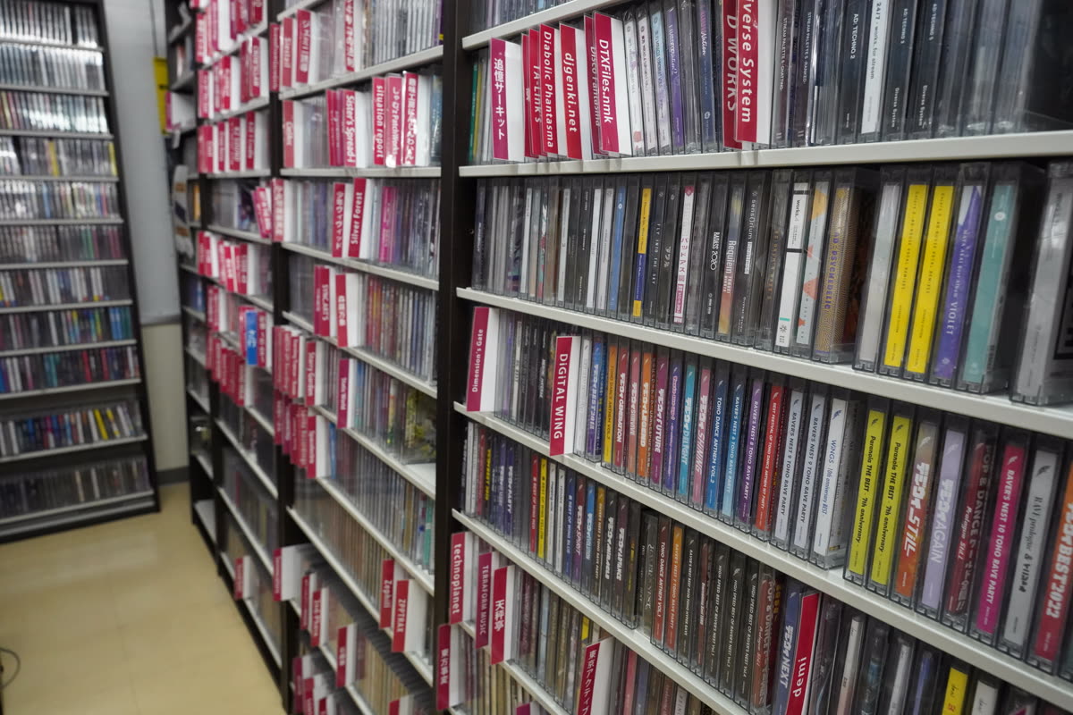 Shelves of Touhou Project derivative music albums in an Akihabara store — 건담베이스 매장 어디에 있나 — 용산과 코엑스
